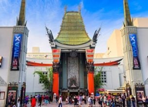 A group of people standing in front of Grauman's Chinese Theatre